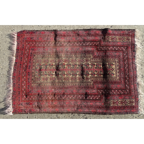 1388 - Carpet / Rug : A rug with red / pink ground and banded geometric decoration  Approx. 54