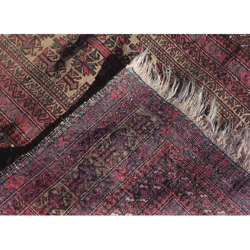 1388 - Carpet / Rug : A rug with red / pink ground and banded geometric decoration  Approx. 54