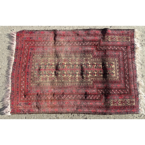 1388 - Carpet / Rug : A rug with red / pink ground and banded geometric decoration  Approx. 54