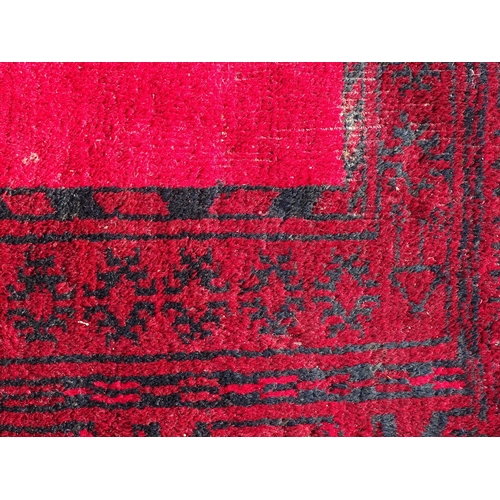 1391 - Carpet / Rug : A Turkoman rug, the red ground with bands of medallions and geometric motifs 
Approx.... 