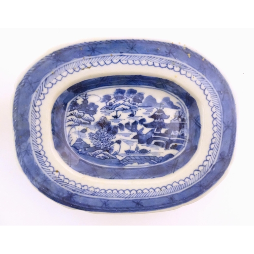 17 - A Chinese blue and white soup tureen of quatrefoil form decorated with a landscape scene with pagoda... 