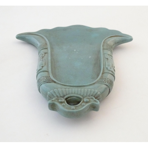21 - A Chinese incense holder / dish of stylised bell form with relief temple bell style decoration. Appr... 