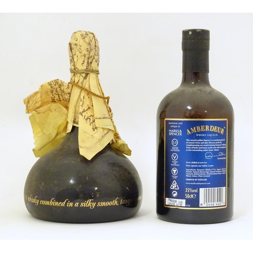 2159 - A 50cl bottle of Amberdeur whisky liqueur, together with a 50cl bottle of William Shakespeare's oran... 