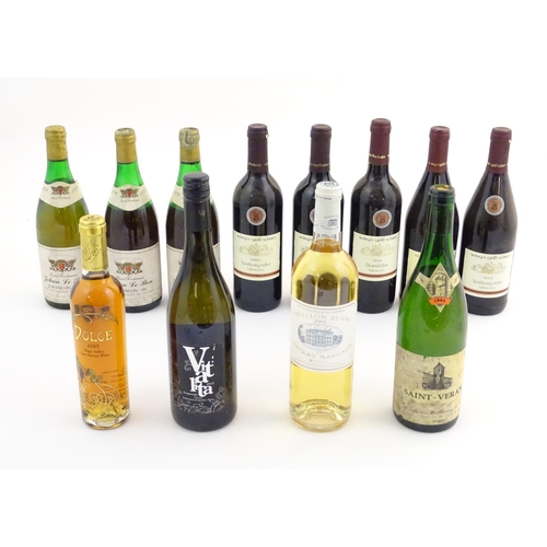 2166 - An assortment of white and red wine, including a 1979 Saint Ferdinand Jehan Le Bon Jurancon Sec 75cl... 