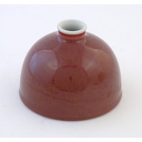 22 - A Chinese sang de boeuf pot of domed form. Character marks under. Approx. 3 3/4