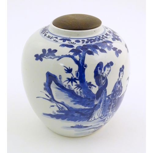 39 - An Oriental blue and white ginger jar decorated with a landscape scene with a figure on horseback wi... 
