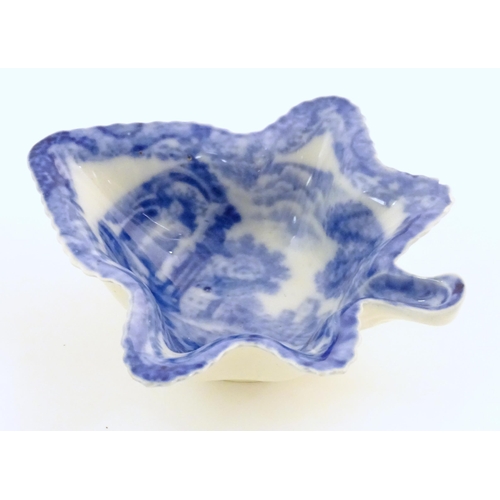 67 - A Spode blue and white pickle dish of vine leaf form decorated with a landscape with Italian ruins. ... 