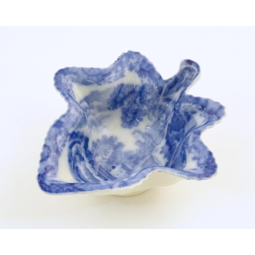 67 - A Spode blue and white pickle dish of vine leaf form decorated with a landscape with Italian ruins. ... 