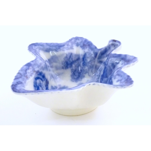 67 - A Spode blue and white pickle dish of vine leaf form decorated with a landscape with Italian ruins. ... 