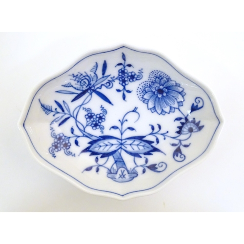 73 - A Continental dish of lozenge form with blue and white decoration depicting flowers and foliage. Wit... 