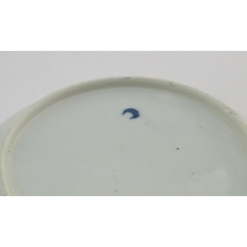 74 - A Worcester blue and white saucer decorated with flowers, foliage and butterflies. Crescent moon mar... 