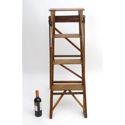 1357 - An early 20thC library step ladder, constructed from beech and ash with four steps, 14