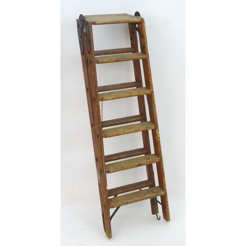 1358 - A mid 20thC combination step / straight ladder, marked The Handy 2 in 1 Ladder, constructed from spr... 