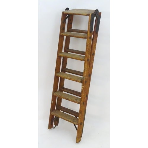 1358 - A mid 20thC combination step / straight ladder, marked The Handy 2 in 1 Ladder, constructed from spr... 