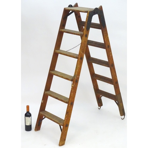 1358 - A mid 20thC combination step / straight ladder, marked The Handy 2 in 1 Ladder, constructed from spr... 