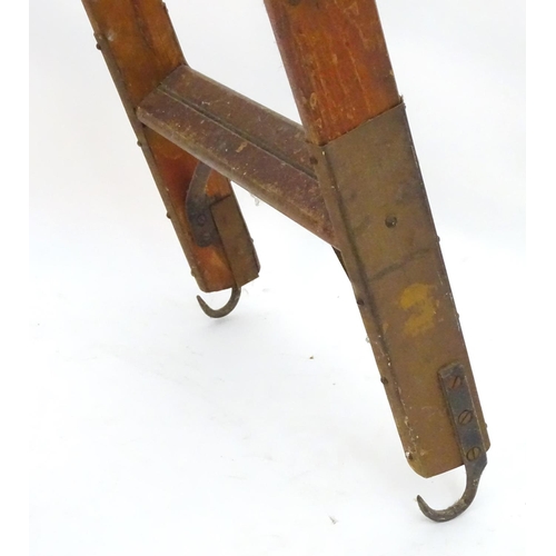 1358 - A mid 20thC combination step / straight ladder, marked The Handy 2 in 1 Ladder, constructed from spr... 