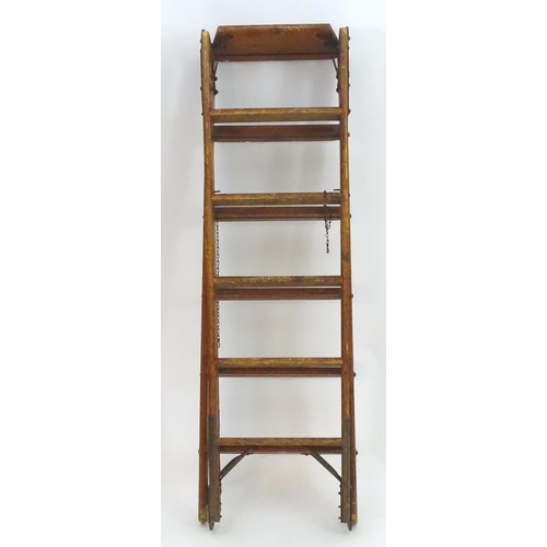 1358 - A mid 20thC combination step / straight ladder, marked The Handy 2 in 1 Ladder, constructed from spr... 