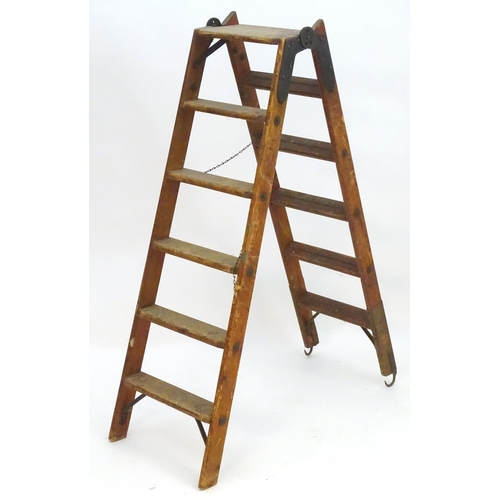 1358 - A mid 20thC combination step / straight ladder, marked The Handy 2 in 1 Ladder, constructed from spr... 