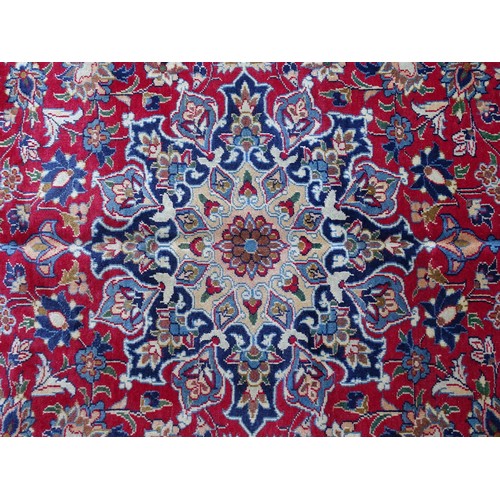 1381 - Carpet / Rug : An Isfahan carpet, the red ground with central medallion and floral and foliate detai... 