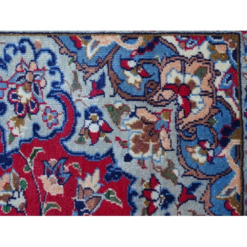 1381 - Carpet / Rug : An Isfahan carpet, the red ground with central medallion and floral and foliate detai... 