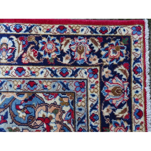 1381 - Carpet / Rug : An Isfahan carpet, the red ground with central medallion and floral and foliate detai... 