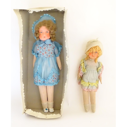 1318 - Toys: Two early to mid 20thC cloth and papier mache dolls, the largest approximately 17