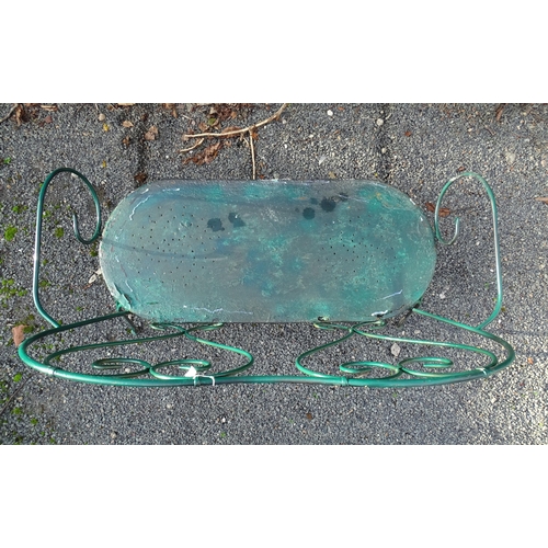 1364 - A two-seater garden bench, of wrought metal construction with two hearts forming the splat, green pa... 