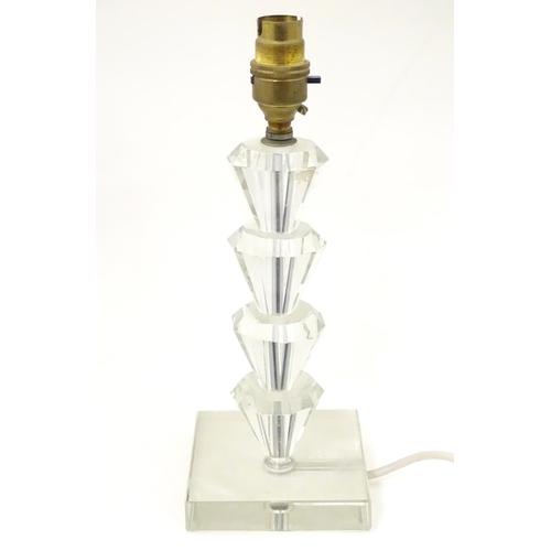 1340 - An Art Deco style table lamp, the glass column of stepped form with a squared base. Approx. 11 1/2