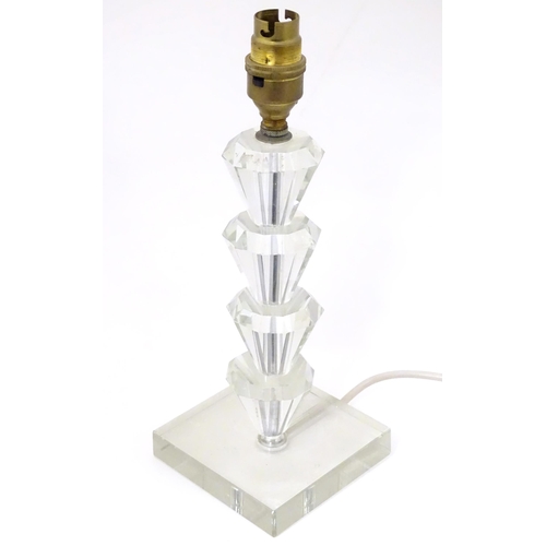 1340 - An Art Deco style table lamp, the glass column of stepped form with a squared base. Approx. 11 1/2