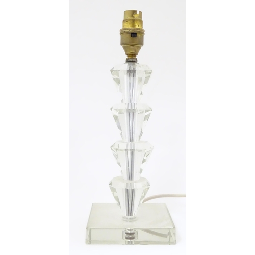 1340 - An Art Deco style table lamp, the glass column of stepped form with a squared base. Approx. 11 1/2