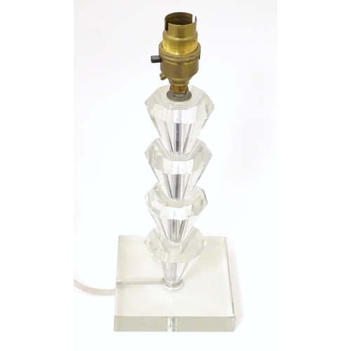 1340 - An Art Deco style table lamp, the glass column of stepped form with a squared base. Approx. 11 1/2