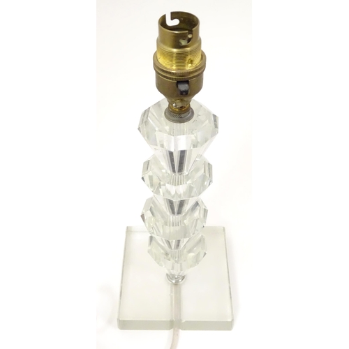 1340 - An Art Deco style table lamp, the glass column of stepped form with a squared base. Approx. 11 1/2