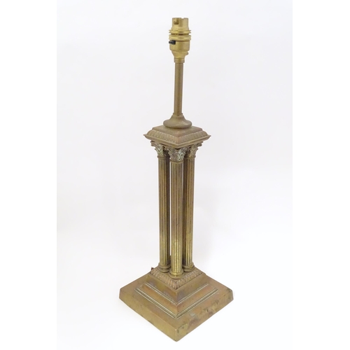 1346 - An early 20thC brass table lamp formed as a Corinthian cluster column, standing on a squared stepped... 