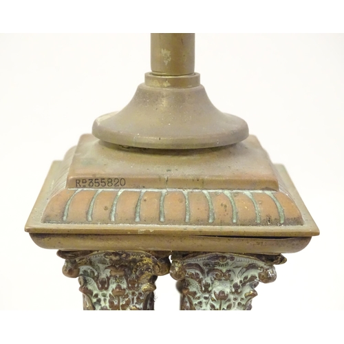 1346 - An early 20thC brass table lamp formed as a Corinthian cluster column, standing on a squared stepped... 