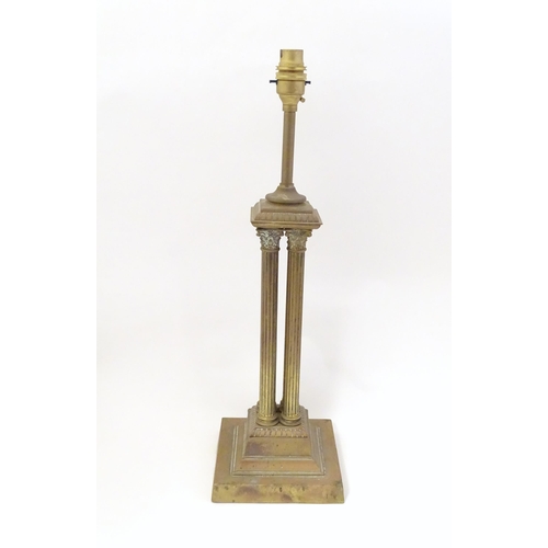 1346 - An early 20thC brass table lamp formed as a Corinthian cluster column, standing on a squared stepped... 