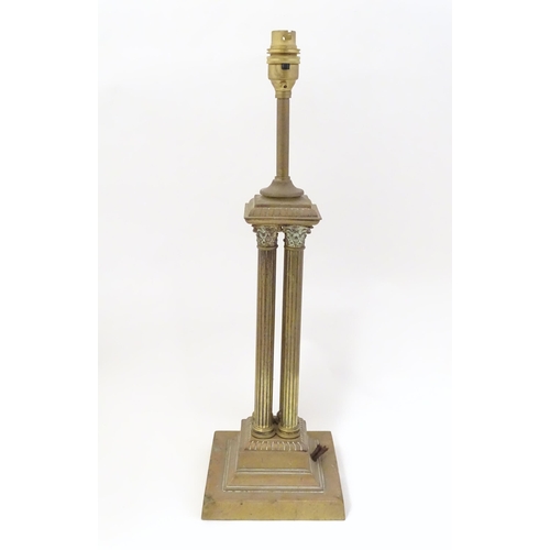 1346 - An early 20thC brass table lamp formed as a Corinthian cluster column, standing on a squared stepped... 