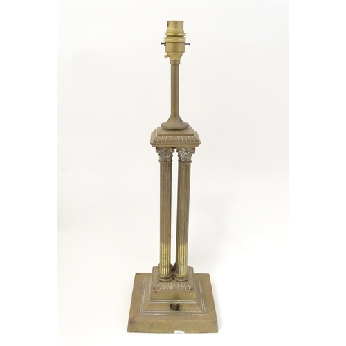 1346 - An early 20thC brass table lamp formed as a Corinthian cluster column, standing on a squared stepped... 