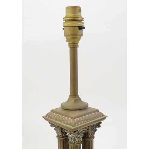 1346 - An early 20thC brass table lamp formed as a Corinthian cluster column, standing on a squared stepped... 