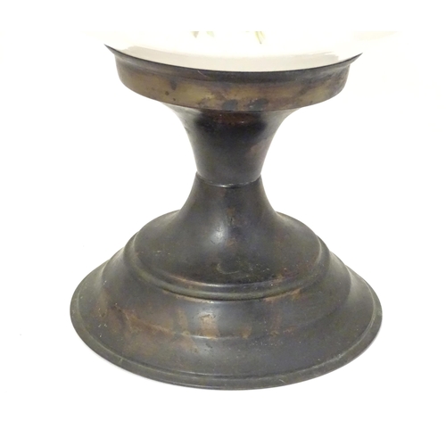 1348 - An early 20thC table oil lamp, the brass column with ceramic mid section decorated with roses and su... 