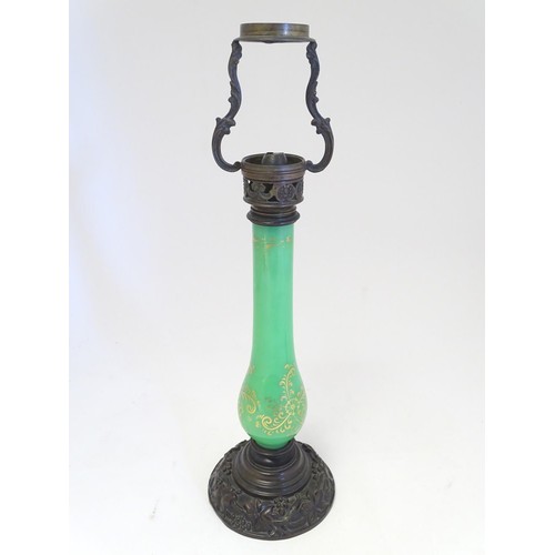 1347 - A 19thC Palmers patent table lamp, the patinated brass fitting supported by a green glass column wit... 