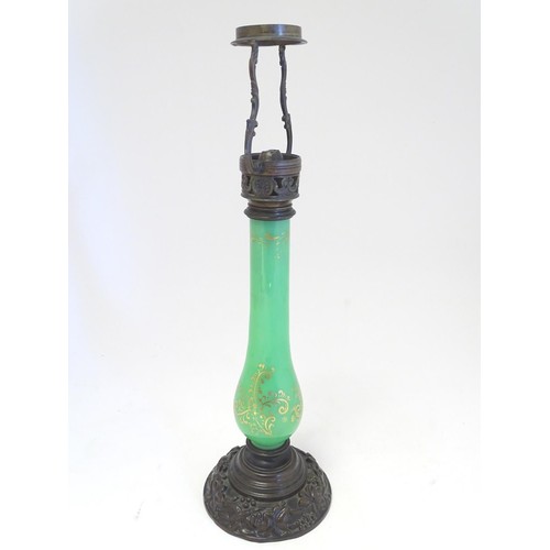 1347 - A 19thC Palmers patent table lamp, the patinated brass fitting supported by a green glass column wit... 