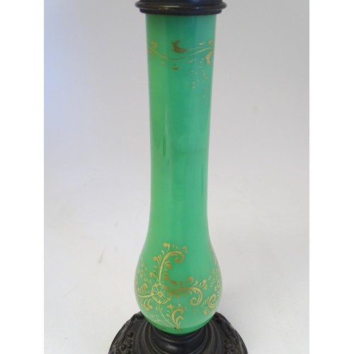 1347 - A 19thC Palmers patent table lamp, the patinated brass fitting supported by a green glass column wit... 