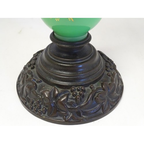 1347 - A 19thC Palmers patent table lamp, the patinated brass fitting supported by a green glass column wit... 