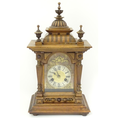 1397 - A Hamburg American Clock Co. mantel / bracket clock with silvered chapter ring, striking on a gong c... 