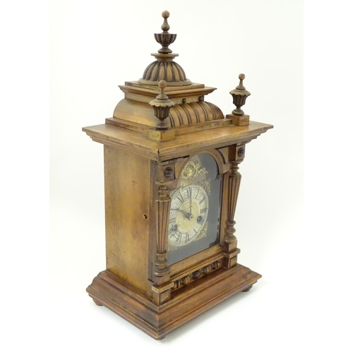 1397 - A Hamburg American Clock Co. mantel / bracket clock with silvered chapter ring, striking on a gong c... 