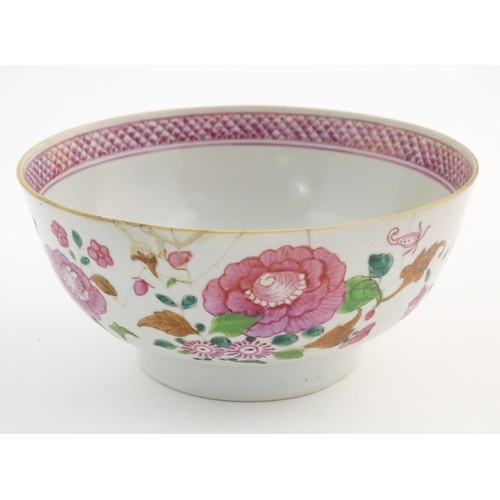45 - A Chinese bowl decorated with flowers and foliage, with floral motif to centre of interior and bande... 