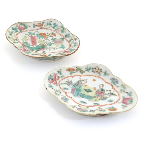 15 - Two Chinese famille rose footed dishes of lozenge form, one decorated with two figures in a landscap... 
