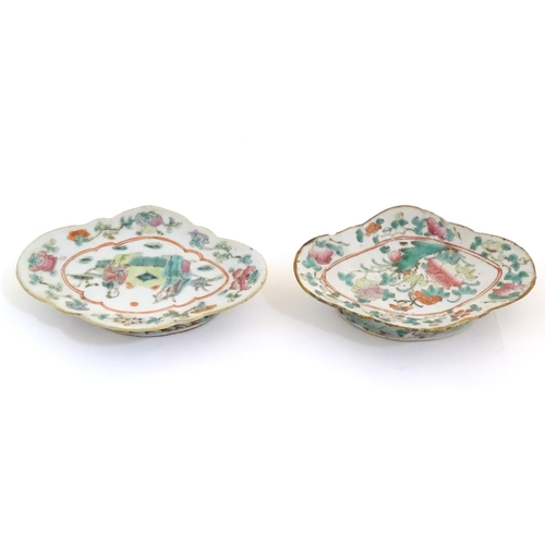 15 - Two Chinese famille rose footed dishes of lozenge form, one decorated with two figures in a landscap... 