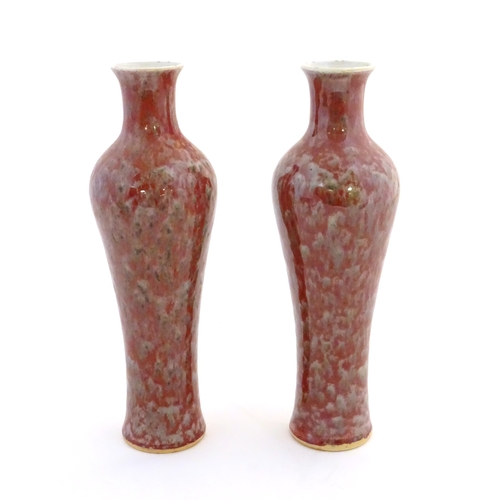 5 - A pair of Chinese vases of elongated form decorated with a mottled glaze. Double ring mark under. Ap... 