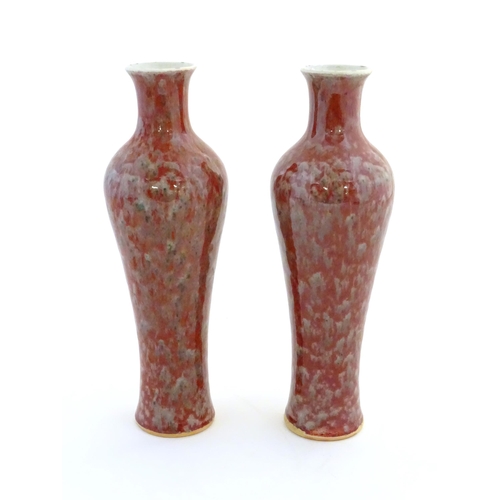 5 - A pair of Chinese vases of elongated form decorated with a mottled glaze. Double ring mark under. Ap... 